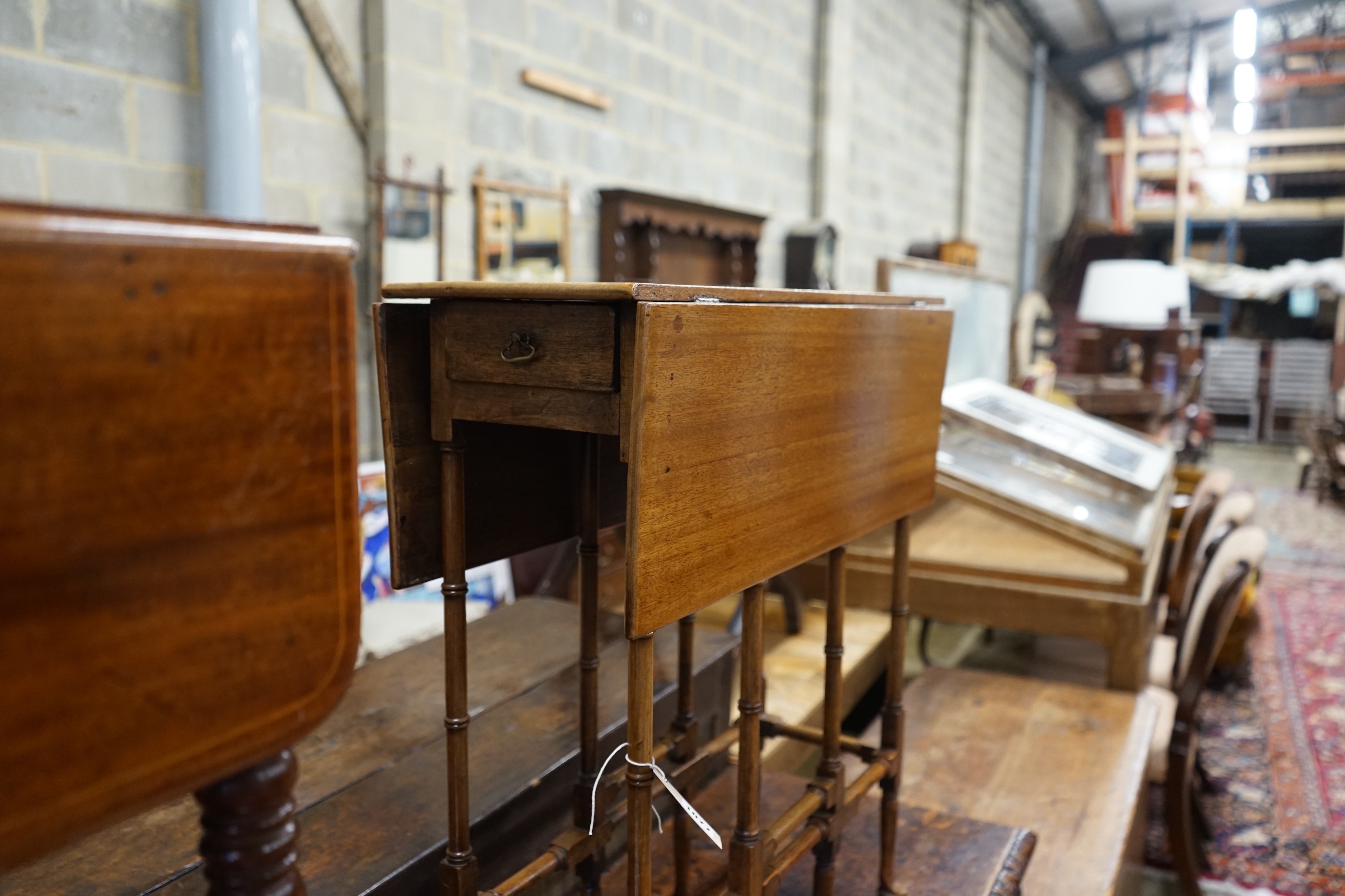 A George III style mahogany spider table, width 60cm, depth 24cm, height 70cm